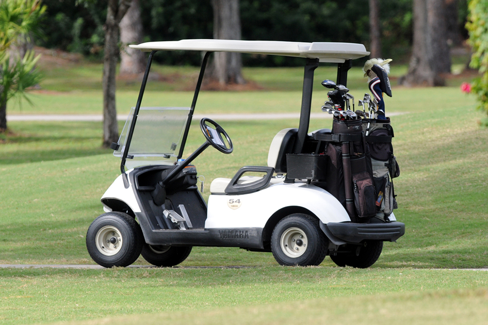 golf cart loaded clubs course
